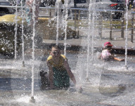 Bathing in Vinnytsia fountain on hot summer day, Ukraine