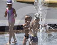 Bathing in Vinnytsia fountain on hot summer day, Ukraine