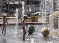 Bathing in Vinnytsia fountain on hot summer day, Ukraine