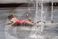 Bathing in Vinnytsia fountain on hot summer day, Ukraine