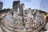 Bathing in Vinnytsia fountain on hot summer day, Ukraine