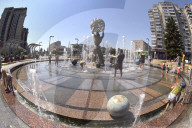 Bathing in Vinnytsia fountain on hot summer day, Ukraine