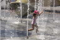 Bathing in Vinnytsia fountain on hot summer day, Ukraine