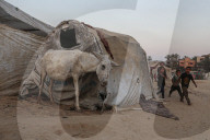 Palestinian families taking refuge in Deir al-Balah tent camp