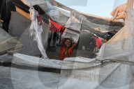 Palestinian families taking refuge in Deir al-Balah tent camp