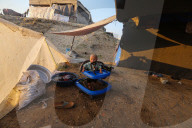 Palestinian families taking refuge in Deir al-Balah tent camp