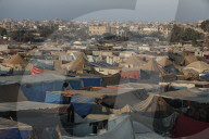Palestinian families taking refuge in Deir al-Balah tent camp