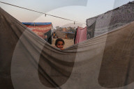 Palestinian families taking refuge in Deir al-Balah tent camp