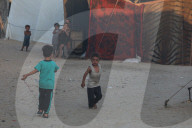 Palestinian families taking refuge in Deir al-Balah tent camp