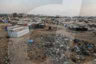 Palestinian families taking refuge in Deir al-Balah tent camp
