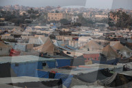 Palestinian families taking refuge in Deir al-Balah tent camp