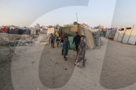 Palestinian families taking refuge in Deir al-Balah tent camp