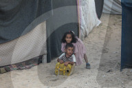 Palestinian families taking refuge in Deir al-Balah tent camp
