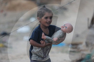 Palestinian families taking refuge in Deir al-Balah tent camp