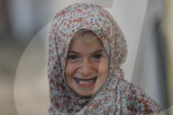 Palestinian families taking refuge in Deir al-Balah tent camp