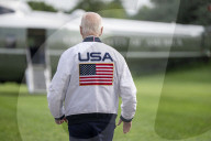 President Joe Biden wears a Team USA jacket as Olympics start