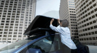 Fold out solar panel roof box to keep EV drivers moving