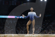 Simone Biles slips off balance beam during finals