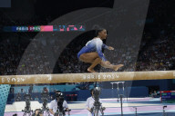 Simone Biles slips off balance beam during finals
