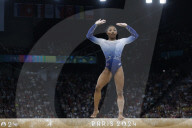 Simone Biles slips off balance beam during finals