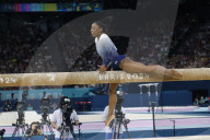 Simone Biles slips off balance beam during finals