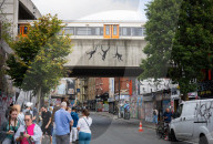 Banksy Three Monkeys artwork on a bridge in Brick Lane, London, UK.
