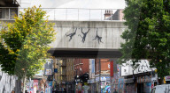Banksy Three Monkeys artwork on a bridge in Brick Lane, London, UK.
