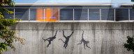 Banksy Three Monkeys artwork on a bridge in Brick Lane, London, UK.