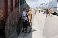 Famlies say their goodbyes as Ukraine soldiers head for frontlines