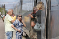 Famlies say their goodbyes as Ukraine soldiers head for frontlines