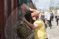 Famlies say their goodbyes as Ukraine soldiers head for frontlines