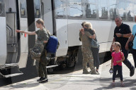Famlies say their goodbyes as Ukraine soldiers head for frontlines