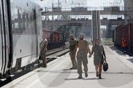 Famlies say their goodbyes as Ukraine soldiers head for frontlines