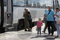 Famlies say their goodbyes as Ukraine soldiers head for frontlines