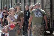 Famlies say their goodbyes as Ukraine soldiers head for frontlines