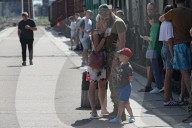 Famlies say their goodbyes as Ukraine soldiers head for frontlines