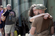 Famlies say their goodbyes as Ukraine soldiers head for frontlines