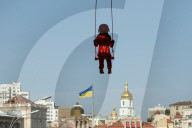 Sculpture of girl on swing by James Colomina in Kyiv