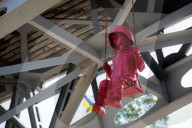 Sculpture of girl on swing by James Colomina in Kyiv