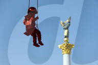 Sculpture of girl on swing by James Colomina in Kyiv