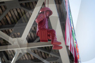 Sculpture of girl on swing by James Colomina in Kyiv