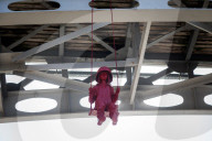 Sculpture of girl on swing by James Colomina in Kyiv