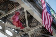 Sculpture of girl on swing by James Colomina in Kyiv