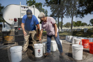 Volunteers beautify veterans' headstones in remembrance of 9/11