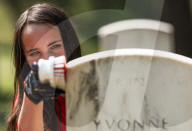 Volunteers beautify veterans' headstones in remembrance of 9/11