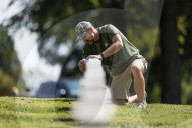 Volunteers beautify veterans' headstones in remembrance of 9/11