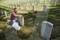 Volunteers beautify veterans' headstones in remembrance of 9/11