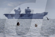 HMS Queen Elizabeth arrives in The Solent in Gosport, UK.
