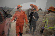 Brazil fire teams fight Amazon blazes - and the arsonists who start them.