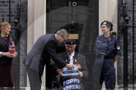 Prime Minister Keir Starmer buys poppy on the steps of No10